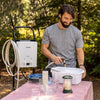 Image of Man Washing Using Onsen 5L Portable Propane Water Heater